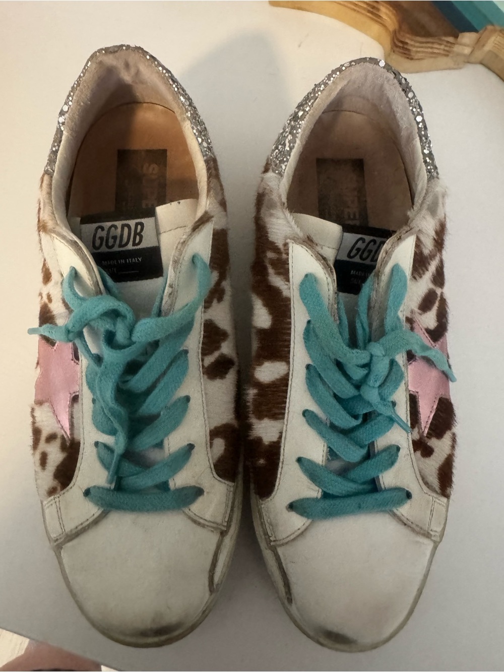 Golden Goose White Cow Print Sneakers with Pink Star and Turquoise Laces